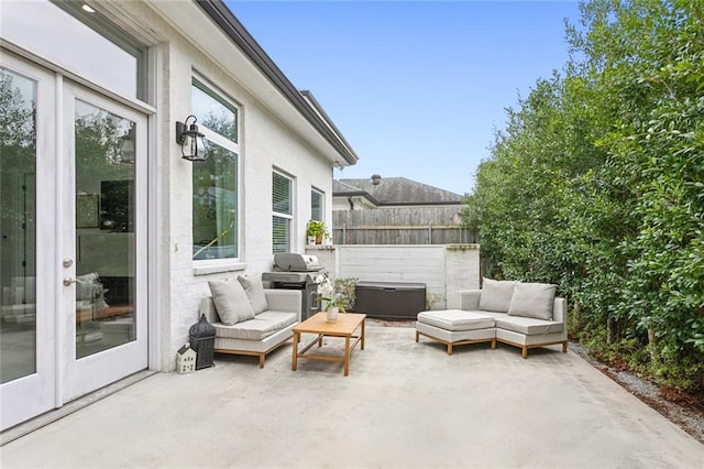 view of patio with an outdoor living space and area for grilling