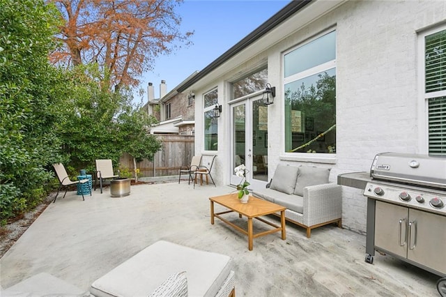 view of patio / terrace with an outdoor living space and a grill