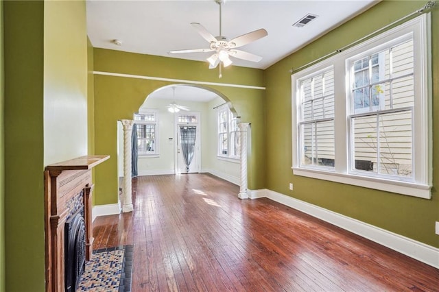 unfurnished living room featuring ceiling fan and wood-type flooring