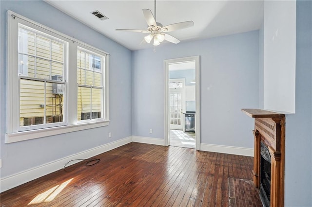 interior space with dark hardwood / wood-style floors and ceiling fan