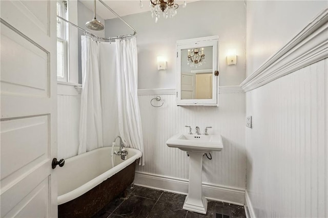 bathroom featuring a chandelier, shower / bath combo, and tile patterned floors