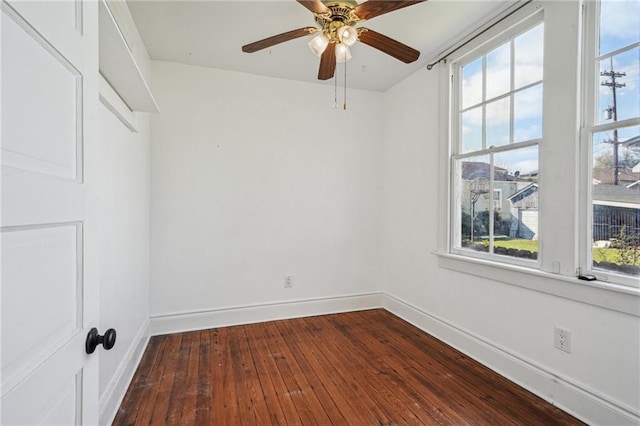 spare room featuring ceiling fan and hardwood / wood-style flooring