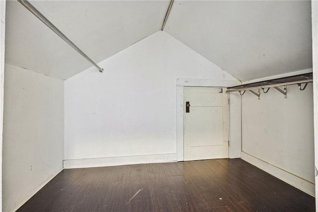 bonus room featuring dark hardwood / wood-style floors and lofted ceiling