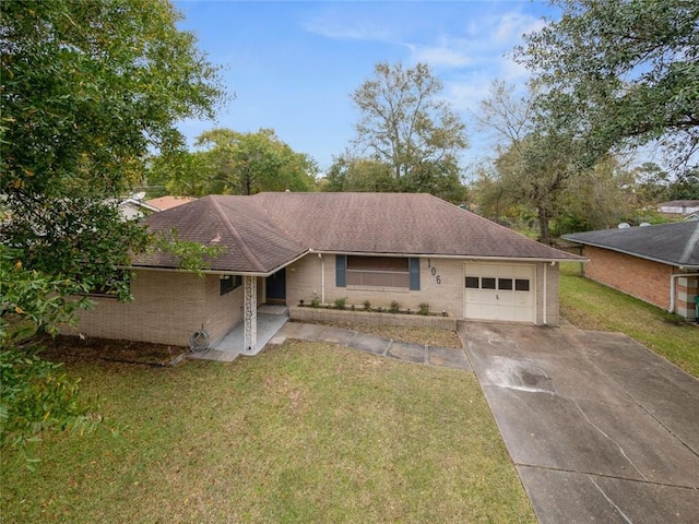 single story home with a front yard and a garage