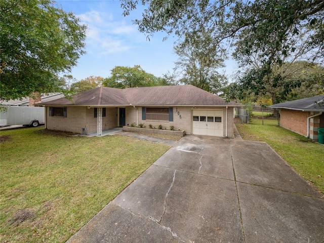 ranch-style home with a garage and a front yard