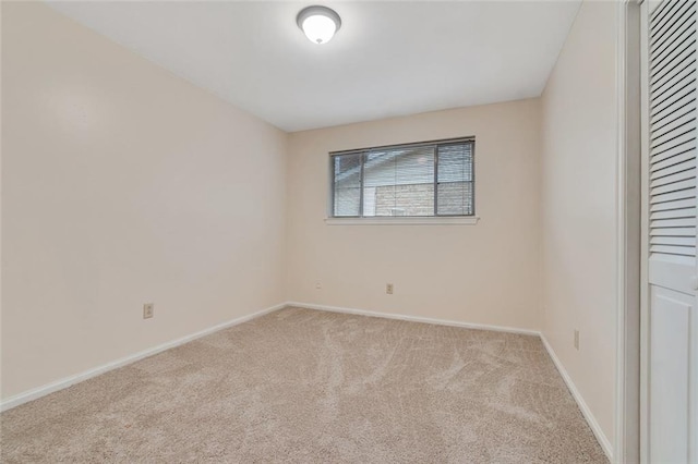 unfurnished bedroom featuring light carpet