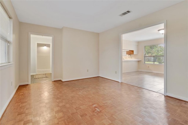 spare room featuring light parquet flooring