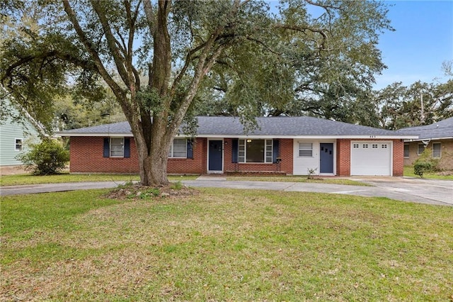 ranch-style home featuring a garage and a front yard