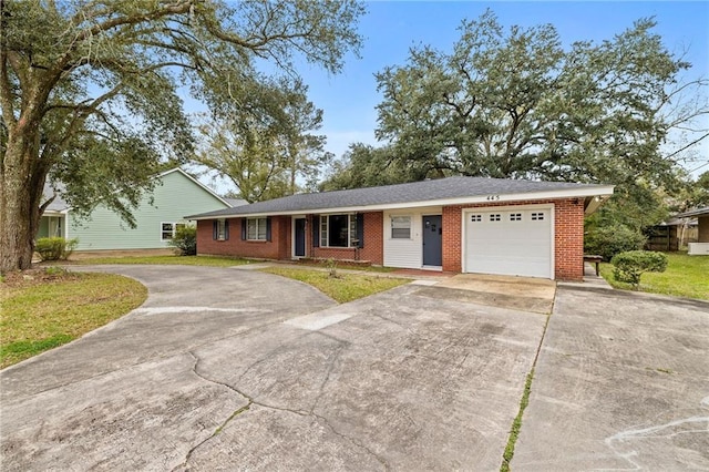 ranch-style house with a front yard and a garage