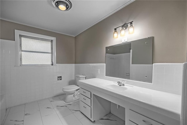 bathroom featuring toilet, tile walls, crown molding, and sink