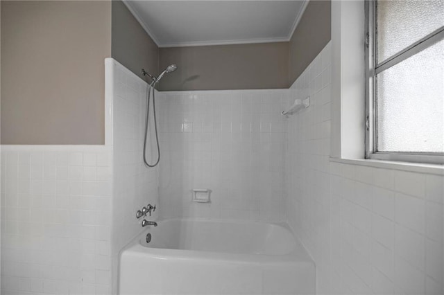 bathroom featuring washtub / shower combination and crown molding