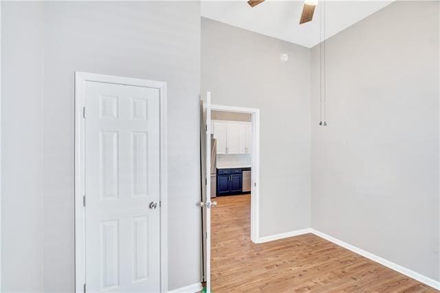 hallway with light hardwood / wood-style flooring