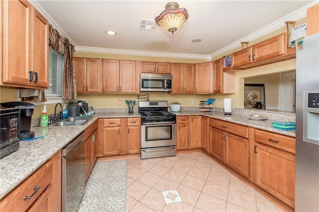 kitchen featuring sink, light tile patterned flooring, ornamental molding, and appliances with stainless steel finishes