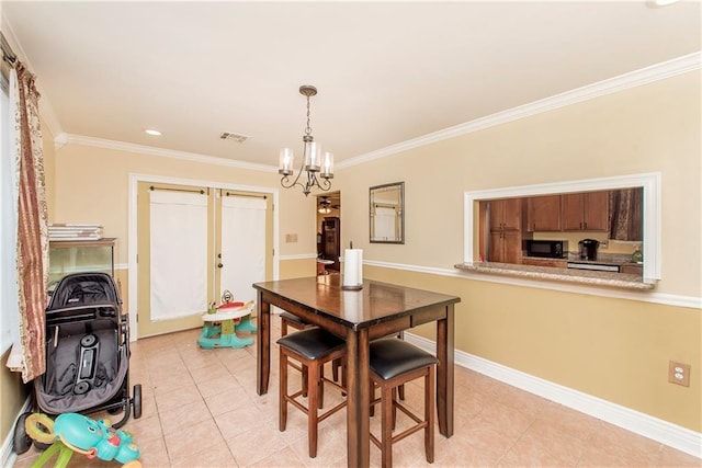 dining space featuring light tile patterned floors, ornamental molding, and a notable chandelier