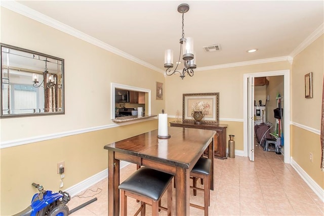 tiled dining area featuring ornamental molding and a notable chandelier