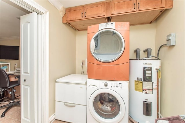 laundry area with cabinets, stacked washer and clothes dryer, crown molding, light tile patterned floors, and water heater