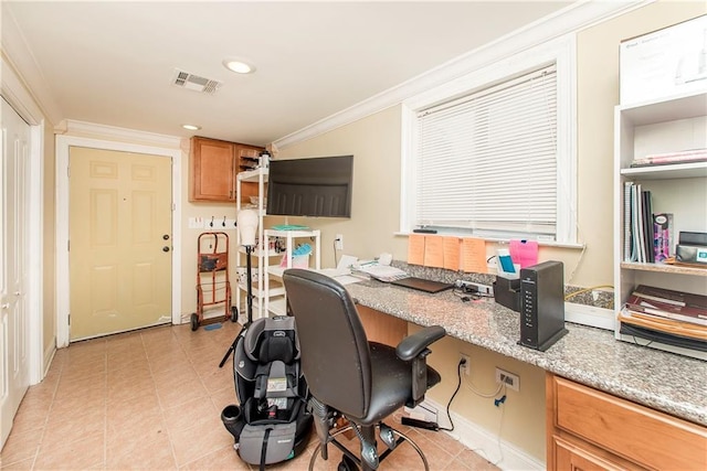 office area featuring light tile patterned floors, built in desk, and ornamental molding