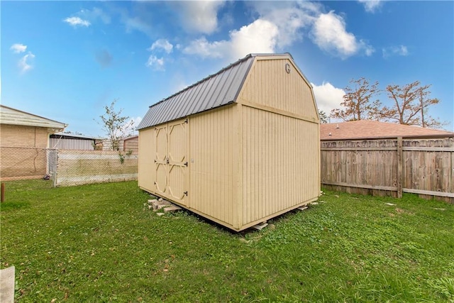 view of outbuilding featuring a yard