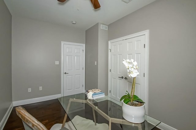 interior space with ceiling fan and hardwood / wood-style floors