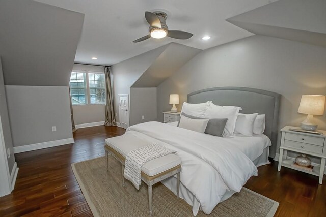 bedroom with dark hardwood / wood-style flooring, ceiling fan, and lofted ceiling