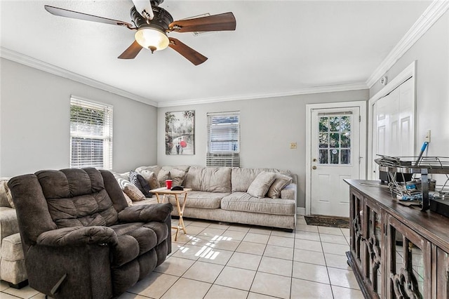 tiled living room with ceiling fan and ornamental molding