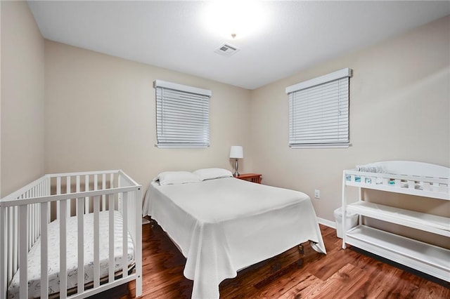 bedroom featuring dark hardwood / wood-style floors