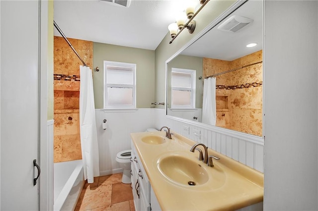 full bathroom with shower / bath combo, vanity, and toilet