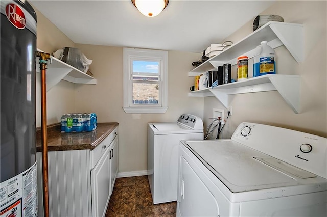 washroom featuring cabinets and washing machine and dryer