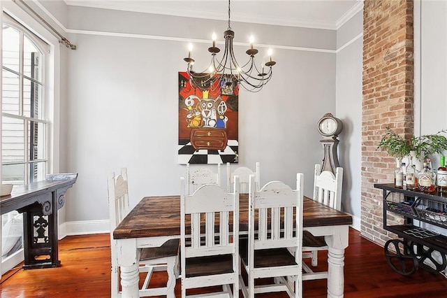 dining room featuring a chandelier, hardwood / wood-style flooring, and ornamental molding