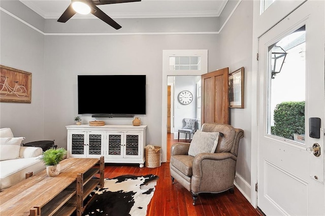 living room with dark hardwood / wood-style floors, ceiling fan, plenty of natural light, and ornamental molding