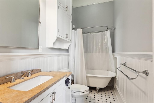 full bathroom with vanity, shower / bath combo, and toilet