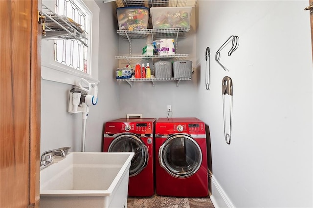 laundry room featuring independent washer and dryer and sink