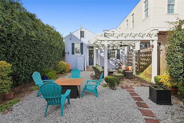 view of patio with a pergola and an outdoor living space with a fire pit