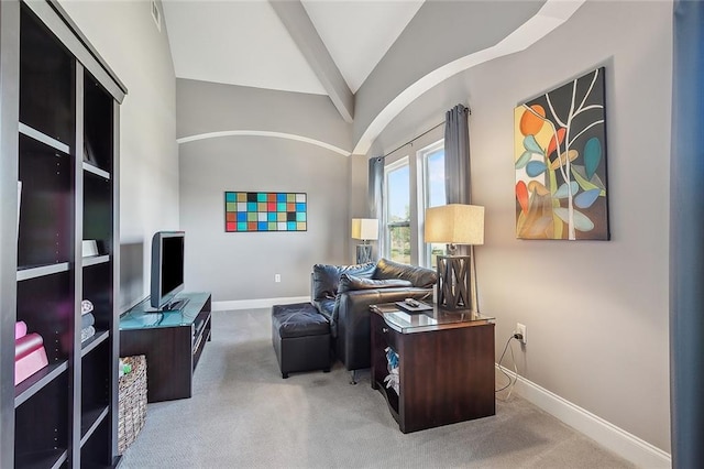 carpeted office featuring vaulted ceiling