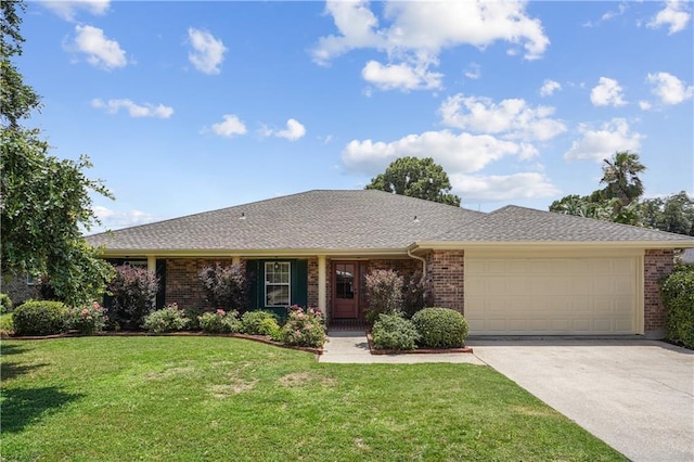 ranch-style home featuring a front yard and a garage