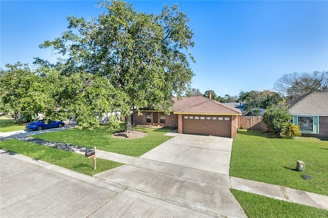 view of front facade featuring a garage and a front yard