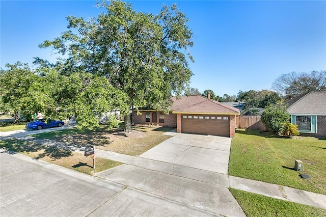 view of front of property with a garage and a front yard