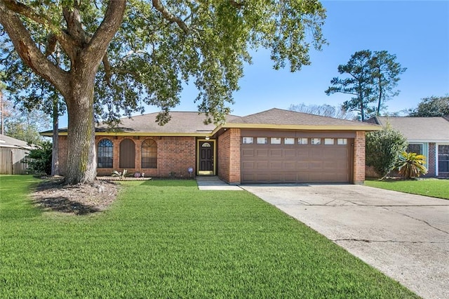 ranch-style house with a garage and a front yard