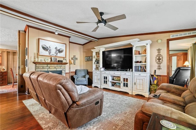 living room featuring a brick fireplace, ceiling fan, dark wood-type flooring, lofted ceiling, and wood walls