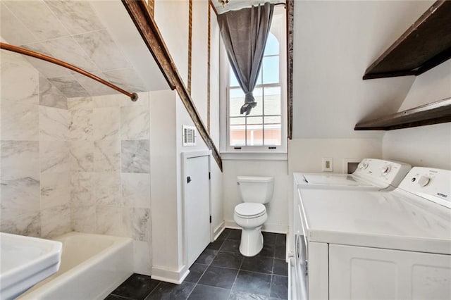 full bathroom featuring baseboards, toilet,  shower combination, vanity, and washing machine and dryer