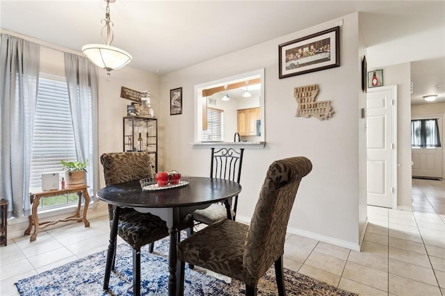 tiled dining area with a healthy amount of sunlight