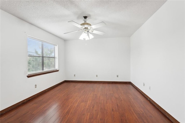 5512 David Dr, Kenner, LA 70065 - empty room with dark wood-style flooring, a ceiling fan, and a textured ceiling