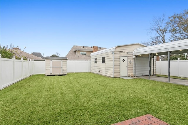 view of yard featuring a carport, a storage unit, and a patio area