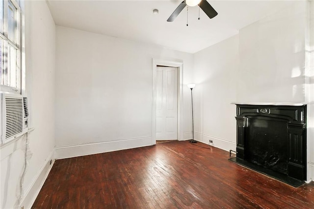 unfurnished living room with ceiling fan and wood-type flooring