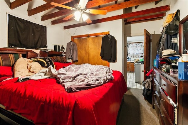 bedroom featuring beamed ceiling, ceiling fan, and carpet floors