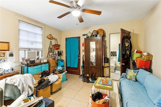 miscellaneous room featuring cooling unit, ceiling fan, and light tile patterned floors