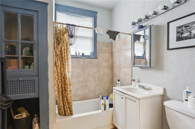 full bathroom with vanity, toilet, and shower / tub combo