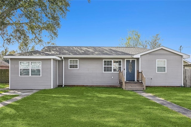 ranch-style house featuring a front yard