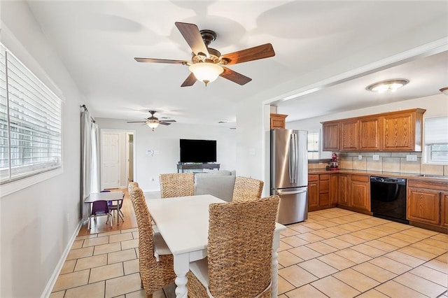 tiled dining room with ceiling fan