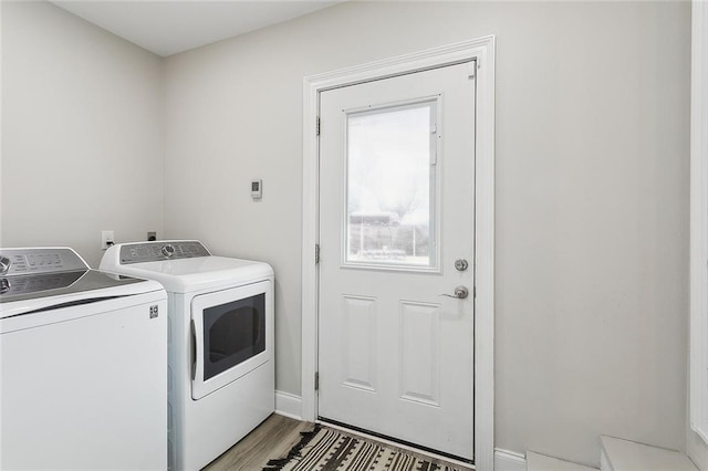 washroom featuring washer and dryer and light hardwood / wood-style flooring